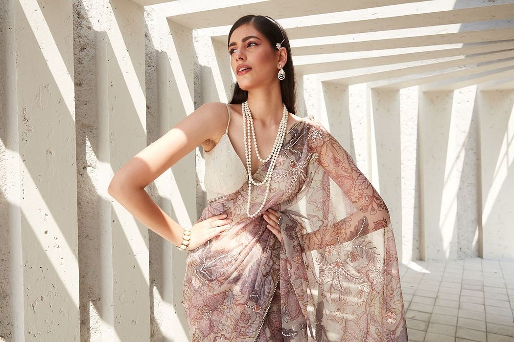 A model showcasing Lilian Print Organza Saree by Ranian from Ranian's collection