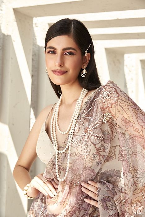 A model showcasing Lilian Print Organza Saree by Ranian from Ranian's collection