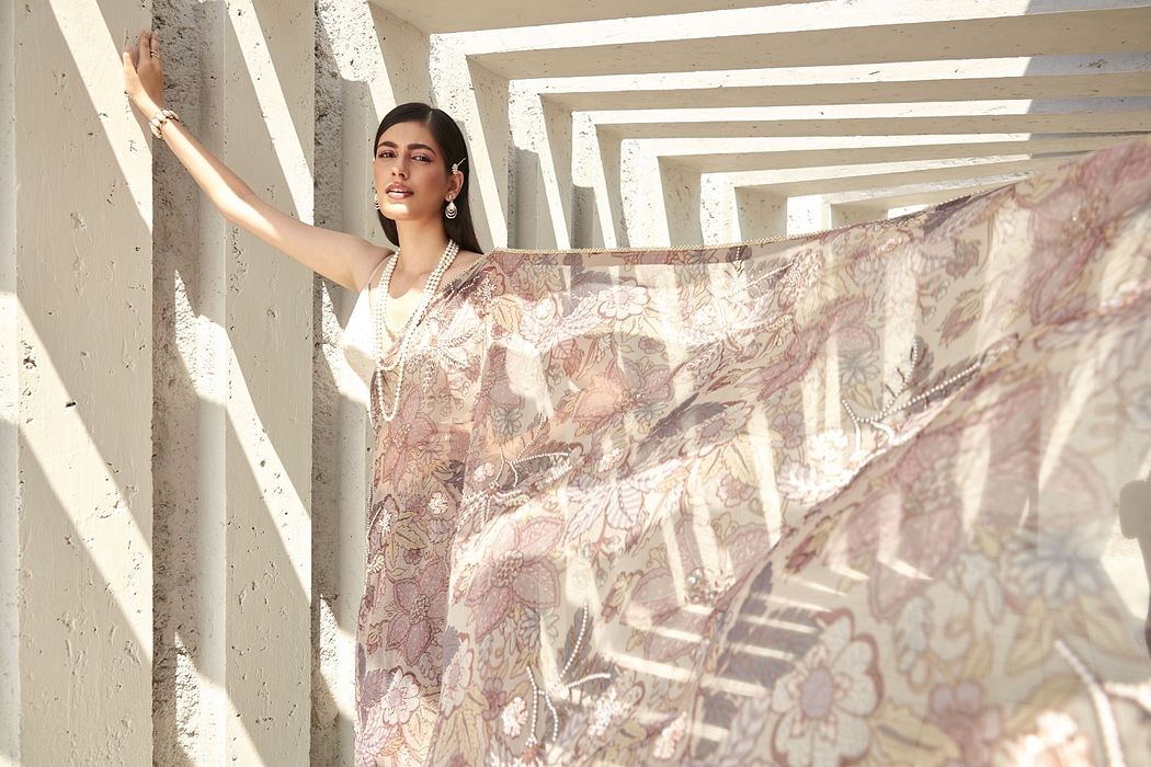 A model showcasing Lilian Print Organza Saree by Ranian from Ranian's collection