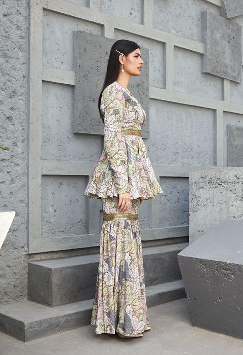 A model showcasing Peplum Garara Set by Ranian from Ranian's collection A model showcasing Peplum Garara Set by Ranian from Ranian's collection