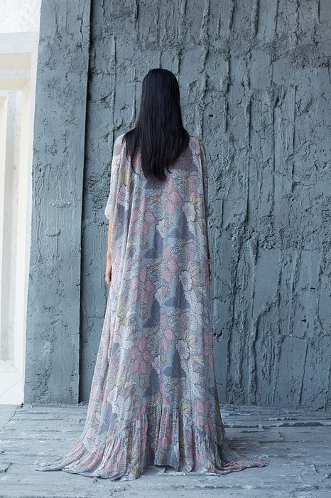 A model showcasing Garara Cape Set by Ranian from Ranian's collection A model showcasing Garara Cape Set by Ranian from Ranian's collection