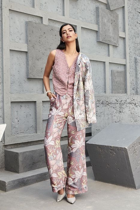 A model showcasing 3 Piece Pants Suit Set by Ranian from Ranian's collection A model showcasing 3 Piece Pants Suit Set by Ranian from Ranian's collection