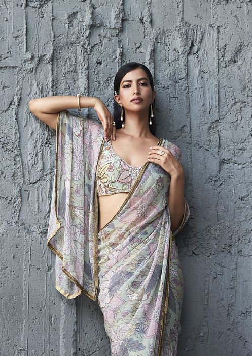 A model showcasing Fluid Georgette Saree by Ranian from Ranian's collection A model showcasing Fluid Georgette Saree by Ranian from Ranian's collection