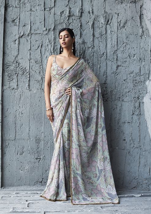 A model showcasing Fluid Georgette Saree by Ranian from Ranian's collection A model showcasing Fluid Georgette Saree by Ranian from Ranian's collection