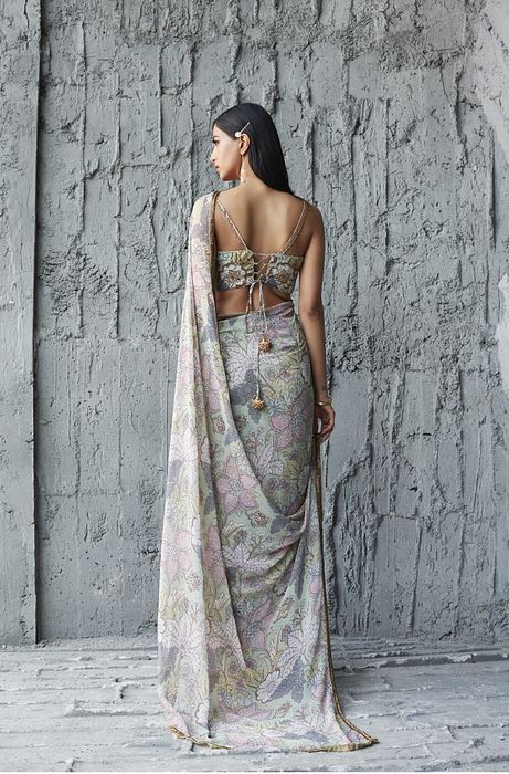 A model showcasing Fluid Georgette Saree by Ranian from Ranian's collection A model showcasing Fluid Georgette Saree by Ranian from Ranian's collection