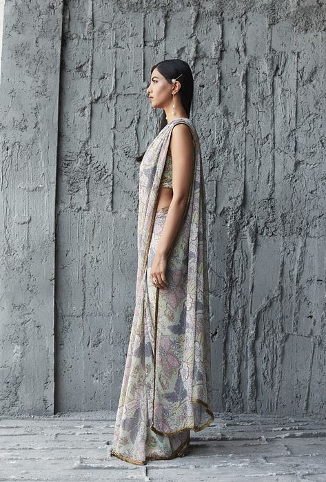 A model showcasing Fluid Georgette Saree by Ranian from Ranian's collection A model showcasing Fluid Georgette Saree by Ranian from Ranian's collection