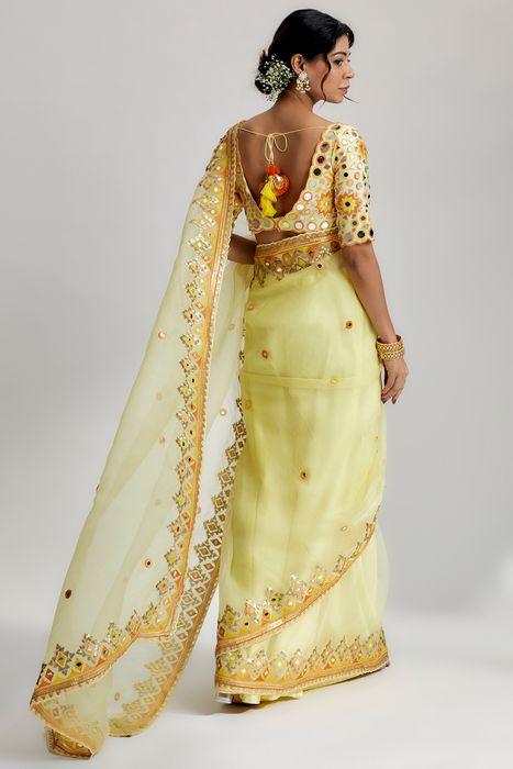 A model showcasing Yellow Priyal Saree by Gopi Vaid from Gopi Vaid's collection