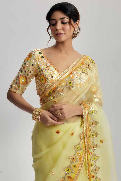 A model showcasing Yellow Priyal Saree by Gopi Vaid from Gopi Vaid's collection