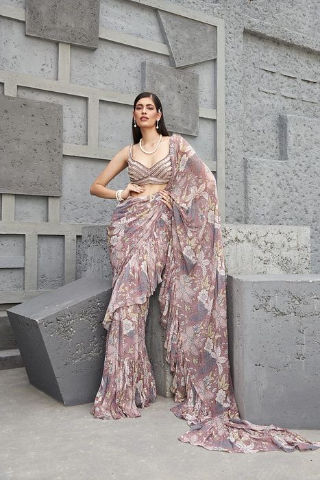 A model showcasing Fluid Drape Saree by Ranian from Ranian's collection A model showcasing Fluid Drape Saree by Ranian from Ranian's collection
