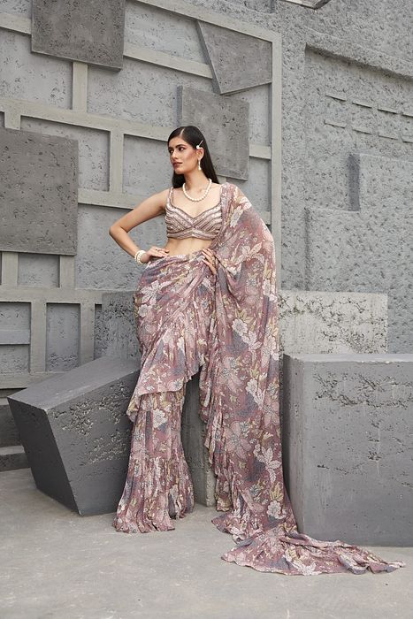 A model showcasing Fluid Drape Saree by Ranian from Ranian's collection A model showcasing Fluid Drape Saree by Ranian from Ranian's collection