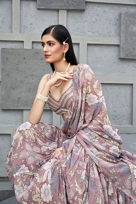 A model showcasing Fluid Drape Saree by Ranian from Ranian's collection A model showcasing Fluid Drape Saree by Ranian from Ranian's collection