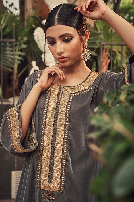 A model showcasing Steel Gray Velvet Kurta Set by Ranian from Ranian's collection A model showcasing Steel Gray Velvet Kurta Set by Ranian from Ranian's collection