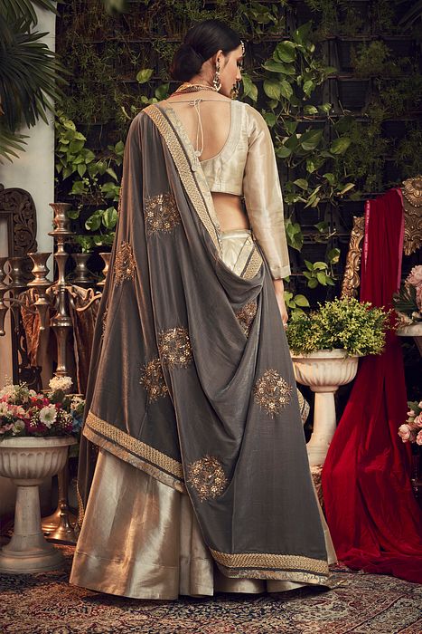 A model showcasing Champagne Lengha Set With Velvet Dupatta Shawl by Ranian from Ranian's collection