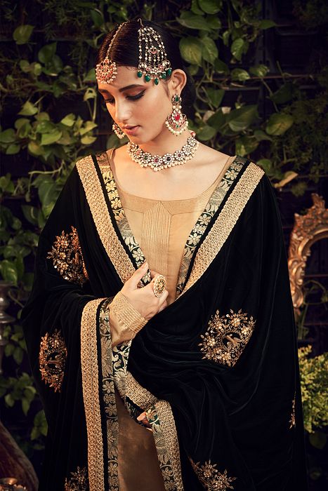 A model showcasing Oxidised Gold Garara Set With Velvet Dupatta by Ranian from Ranian's collection A model showcasing Oxidised Gold Garara Set With Velvet Dupatta by Ranian from Ranian's collection