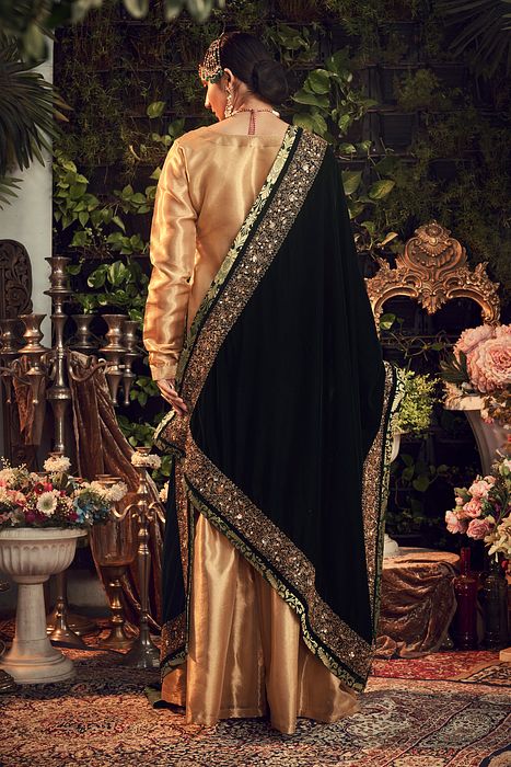 A model showcasing Gold Garara Set With Velvet Dupatta by Ranian from Ranian's collection A model showcasing Gold Garara Set With Velvet Dupatta by Ranian from Ranian's collection