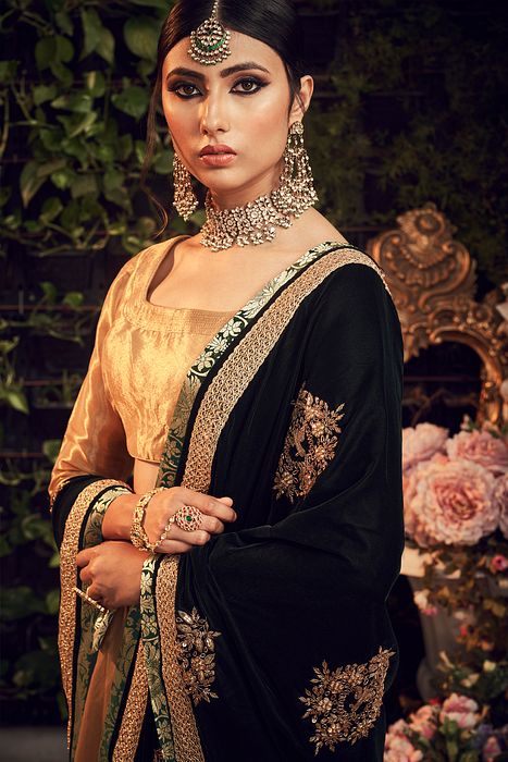 A model showcasing Gold Lehenga With Velvet Dupatta by Ranian from Ranian's collection A model showcasing Gold Lehenga With Velvet Dupatta by Ranian from Ranian's collection