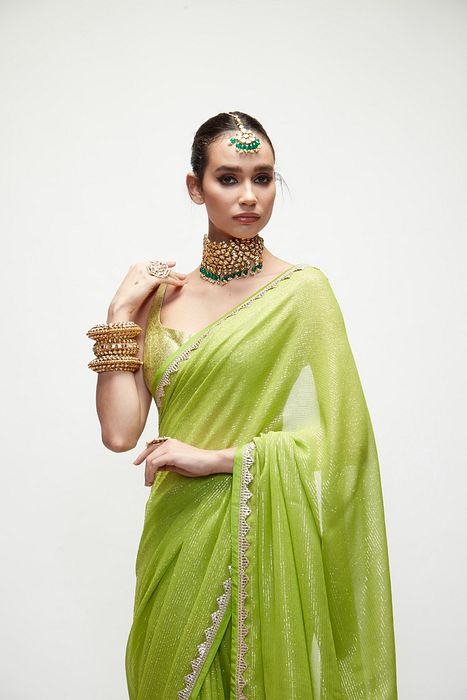 A model showcasing Chartreuse Green Mettalic Saree Set by Ranian from Ranian's collection