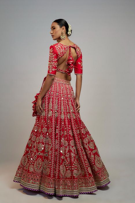 A model showcasing Red Golconda Jasmin Lehenga Set by Gopi Vaid from Gopi Vaid's collection