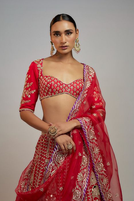 A model showcasing Red Golconda Jasmin Lehenga Set by Gopi Vaid from Gopi Vaid's collection