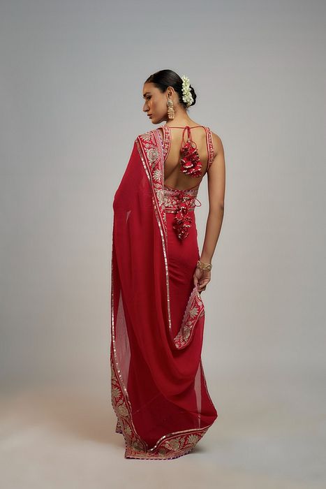 A model showcasing Red Golconda Vidhi Saree Set by Gopi Vaid from Gopi Vaid's collection A model showcasing Red Golconda Vidhi Saree Set by Gopi Vaid from Gopi Vaid's collection