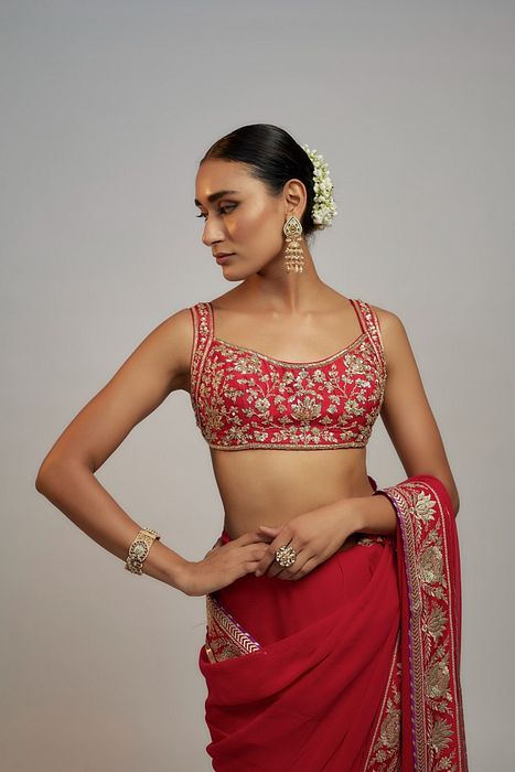 A model showcasing Red Golconda Vidhi Saree Set by Gopi Vaid from Gopi Vaid's collection A model showcasing Red Golconda Vidhi Saree Set by Gopi Vaid from Gopi Vaid's collection