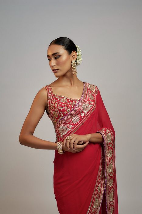 A model showcasing Red Golconda Vidhi Saree Set by Gopi Vaid from Gopi Vaid's collection A model showcasing Red Golconda Vidhi Saree Set by Gopi Vaid from Gopi Vaid's collection