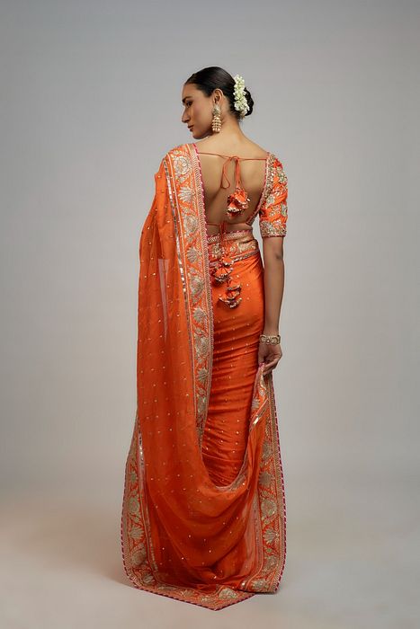 A model showcasing Golconda Orange Fez Saree Set by Gopi Vaid from Gopi Vaid's collection