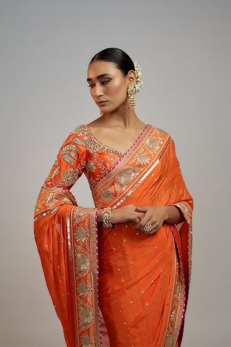 A model showcasing Golconda Orange Fez Saree Set by Gopi Vaid from Gopi Vaid's collection