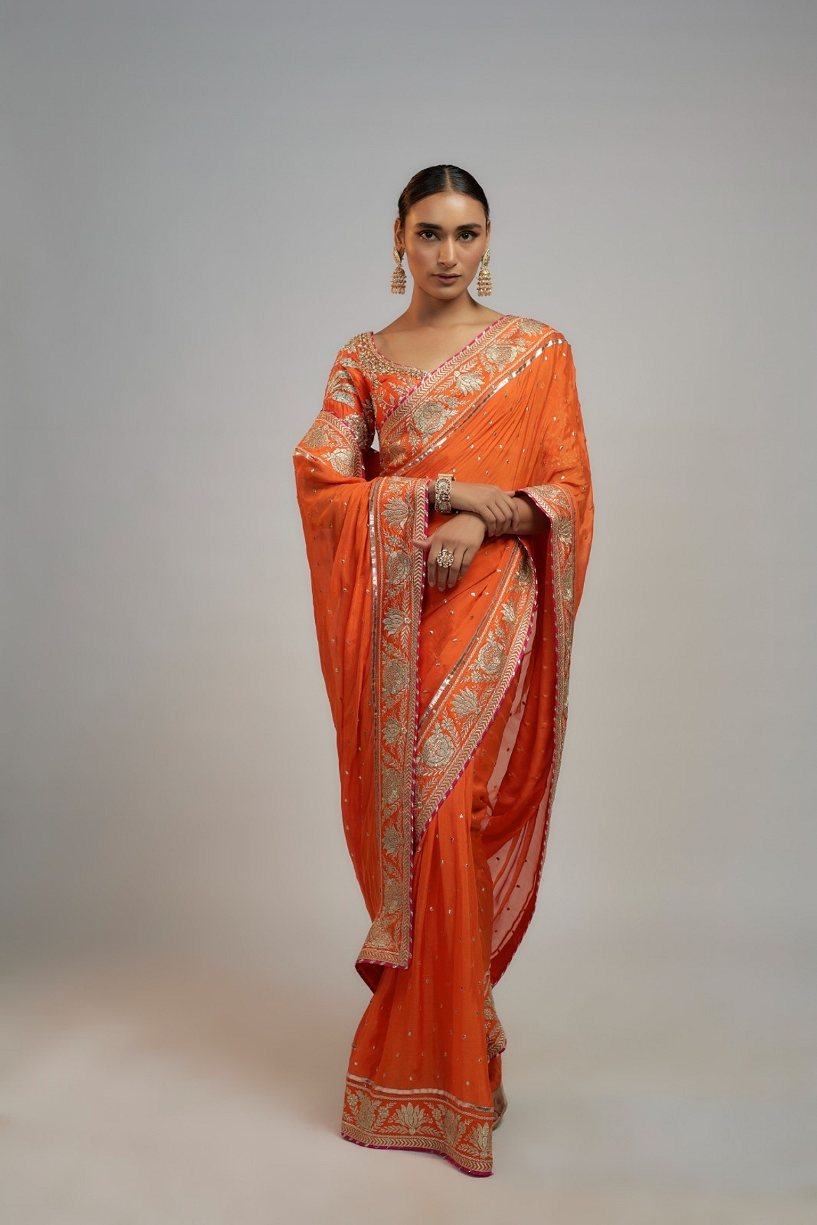 A model showcasing Golconda Orange Fez Saree Set Feature image by Gopi Vaid from Gopi Vaid's collection