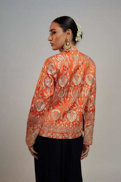 A model showcasing Golconda Orange Saba Blazer by Gopi Vaid from Gopi Vaid's collection