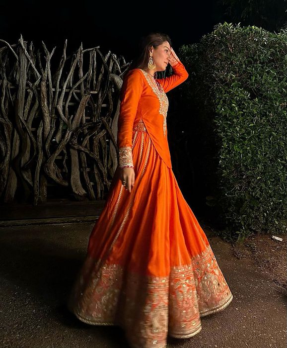 A model showcasing Golconda Orange Zeel Skirt Set by Gopi Vaid from Gopi Vaid's collection