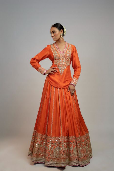 A model showcasing Golconda Orange Zeel Skirt Set by Gopi Vaid from Gopi Vaid's collection