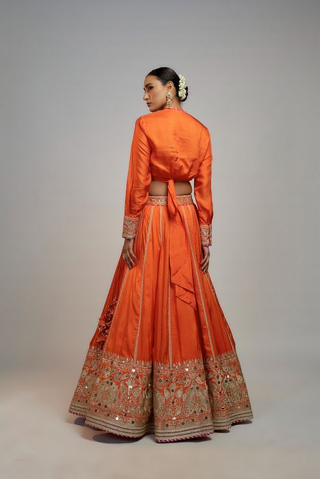 A model showcasing Golconda Orange Zeel Skirt Set by Gopi Vaid from Gopi Vaid's collection