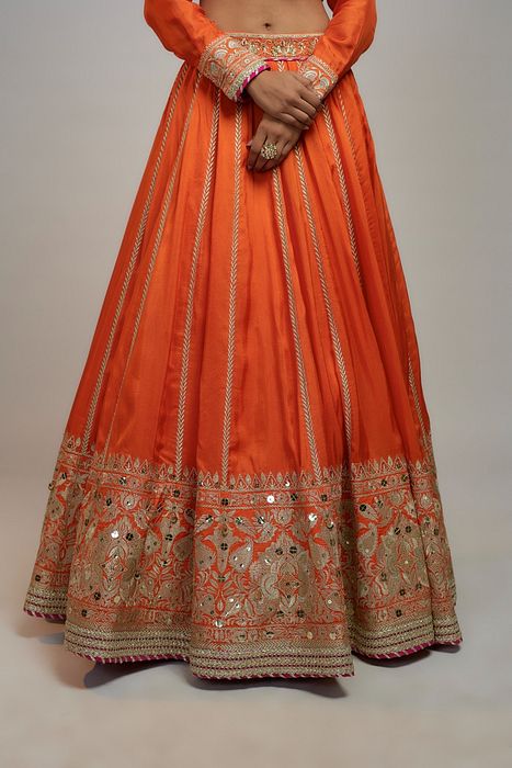 A model showcasing Golconda Orange Zeel Skirt Set by Gopi Vaid from Gopi Vaid's collection