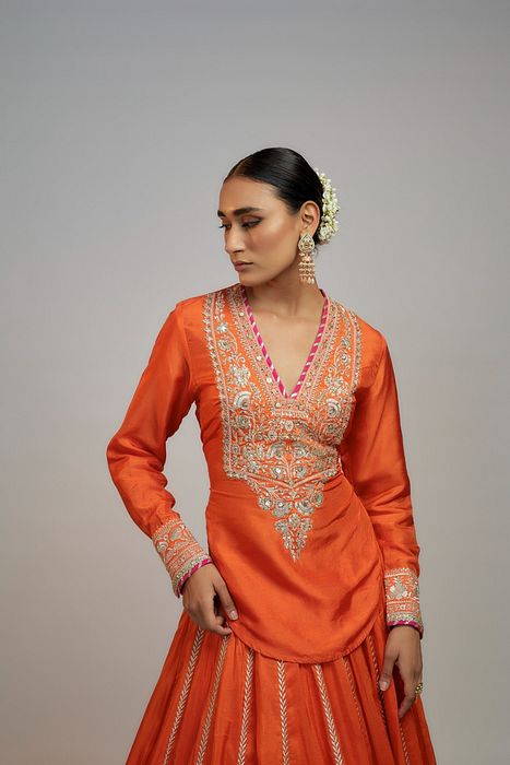 A model showcasing Golconda Orange Zeel Skirt Set by Gopi Vaid from Gopi Vaid's collection