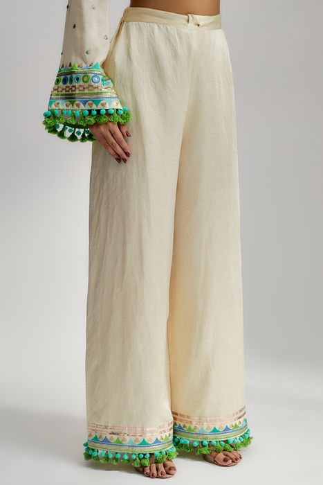 A model showcasing Nishika Long Kurta With Palazzo In Ivory by Gopi Vaid from Gopi Vaid's collection