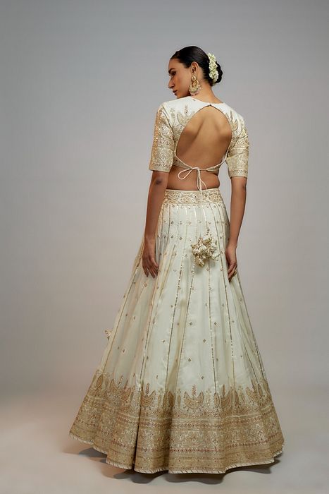 A model showcasing Golconda White Naima Lehenga Set by Gopi Vaid from Gopi Vaid's collection