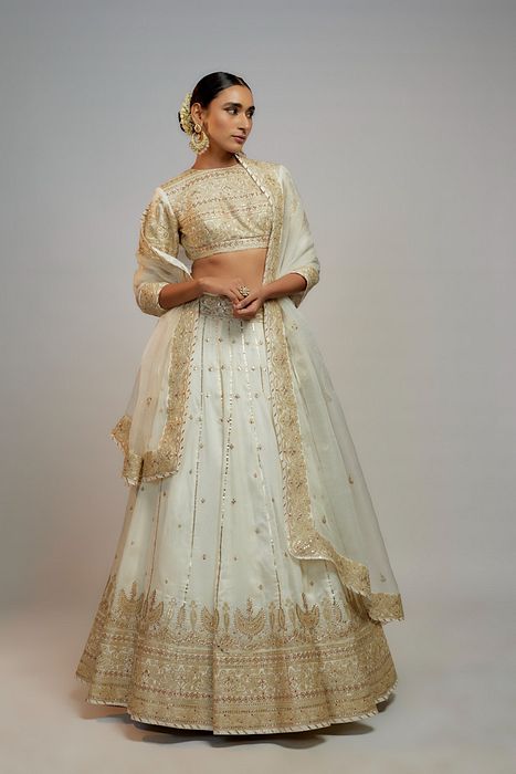 A model showcasing Golconda White Naima Lehenga Set by Gopi Vaid from Gopi Vaid's collection