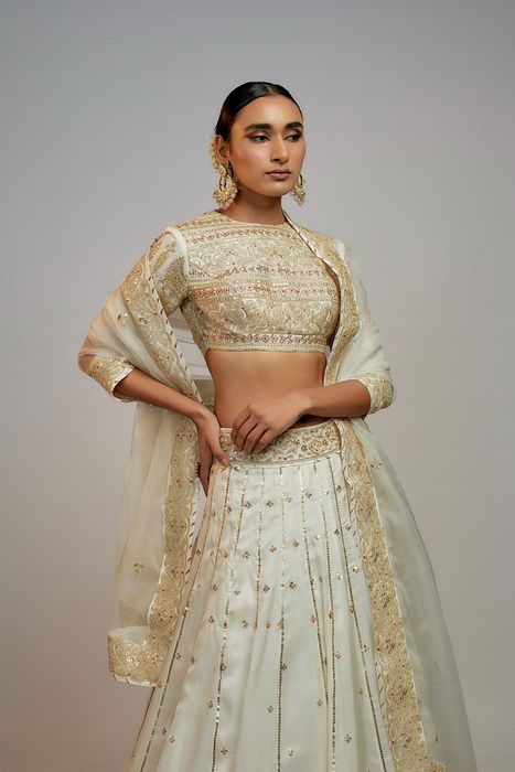 A model showcasing Golconda White Naima Lehenga Set by Gopi Vaid from Gopi Vaid's collection