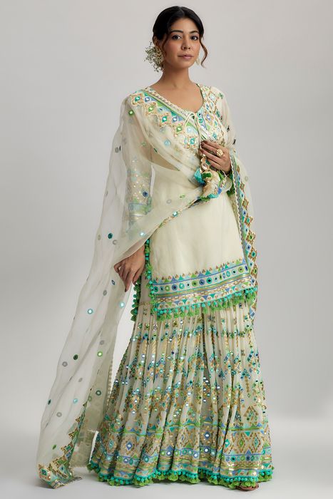 A model showcasing Ivory Friya Short Kurta Sharara Set by Gopi Vaid from Gopi Vaid's collection