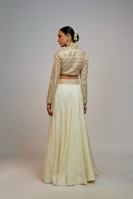 A model showcasing Golconda White Shaziya Skirt Set by Gopi Vaid from Gopi Vaid's collection