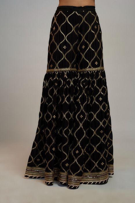 A model showcasing Golconda Black Aarva Strappy Set by Gopi Vaid from Gopi Vaid's collection