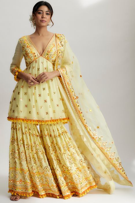 A model showcasing Yellow Sophie Peplum With Sharara Set by Gopi Vaid from Gopi Vaid's collection