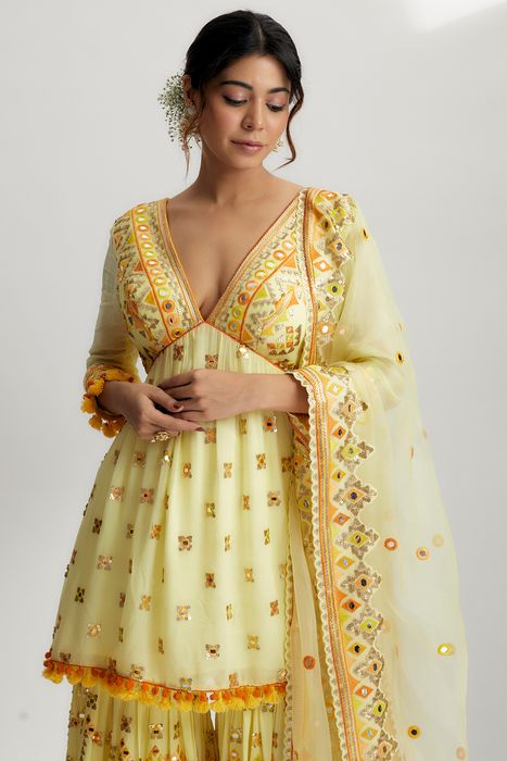 A model showcasing Yellow Sophie Peplum With Sharara Set by Gopi Vaid from Gopi Vaid's collection
