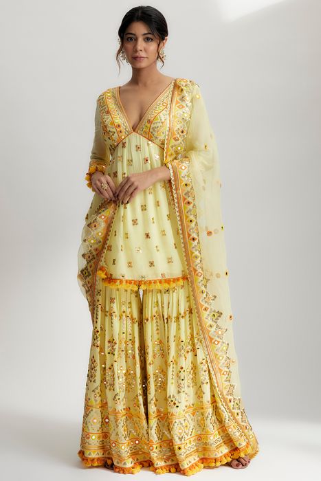 A model showcasing Yellow Sophie Peplum With Sharara Set by Gopi Vaid from Gopi Vaid's collection
