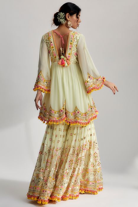 A model showcasing Mint Zohra Peplum With Sharara Set by Gopi Vaid from Gopi Vaid's collection