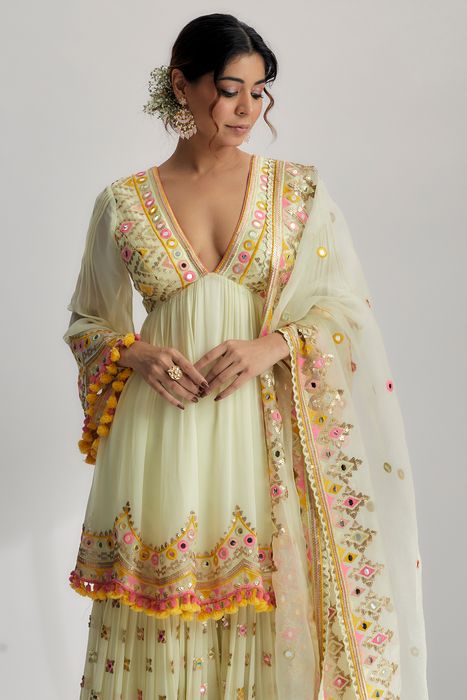 A model showcasing Mint Zohra Peplum With Sharara Set by Gopi Vaid from Gopi Vaid's collection