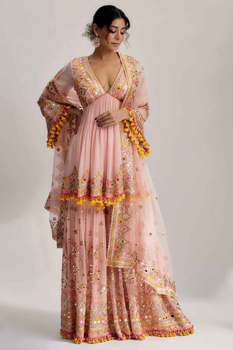 A model showcasing Pink Zohra Peplum With Sharara Feature image by Gopi Vaid from Gopi Vaid's collection