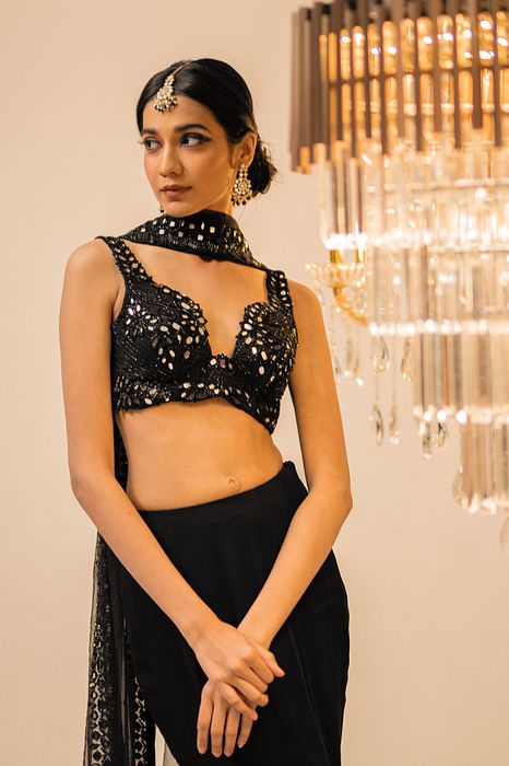 A model showcasing Black Pant Dupatta Set by Foram Patel from Foram Patel's collection