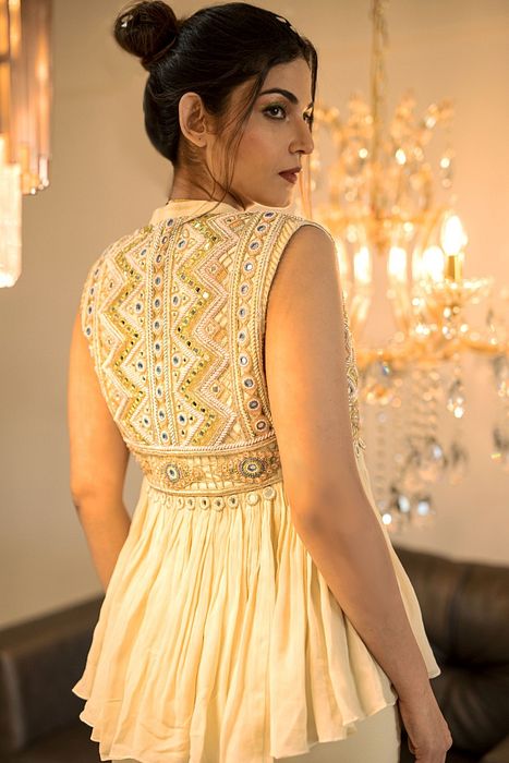 A model showcasing Cream Gharara Jacket Set by Foram Patel from Foram Patel's collection